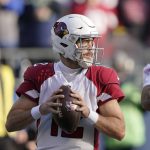 Arizona Cardinals quarterback Colt McCoy readies a pass against the Seattle Seahawks during the first half of an NFL football game, Sunday, Nov. 21, 2021, in Seattle. (AP Photo/Ted S. Warren)
