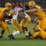 Southern California running back Keaontay Ingram (28) has nowhere to run against Arizona State's defensive line during the first half of an NCAA college football game Saturday, Nov. 6, 2021, in Tempe, Ariz. (AP Photo/Darryl Webb)