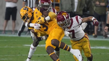 Arizona State running back Rachaad White (3) gets wrapped up by Southern California's Calen Bullock...