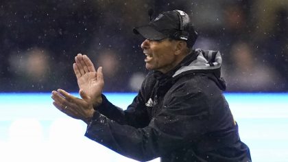 Arizona State coach Herm Edwards applauds the team during the second half of an NCAA college footba...