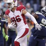 Arizona Cardinals' Zach Ertz (86) scores against the Seattle Seahawks during the first half of an NFL football game, Sunday, Nov. 21, 2021, in Seattle. (AP Photo/John Froschauer)