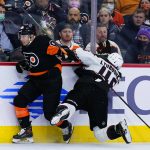 Philadelphia Flyers' Cam Atkinson, left, and Arizona Coyotes' Ilya Lyubushkin collide during the second period of an NHL hockey game, Tuesday, Nov. 2, 2021, in Philadelphia. (AP Photo/Matt Slocum)