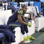 Seattle Seahawks' Tyler Lockett sits on the bench late in the second half of an NFL football game against the Arizona Cardinals, Sunday, Nov. 21, 2021, in Seattle. (AP Photo/Ted S. Warren)