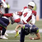 Arizona Cardinals' Rondale Moore (4) is upended by Seattle Seahawks'Jason Myers on a kick return during the second half of an NFL football game, Sunday, Nov. 21, 2021, in Seattle. The Cardinals won 23-13. (AP Photo/John Froschauer)