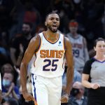 Phoenix Suns forward Mikal Bridges celebrates a score by Cameron Johnson against the New Orleans Pelicans during the second half of an NBA basketball game Tuesday, Nov. 2, 2021, in Phoenix. The Suns won 112-100. (AP Photo/Ross D. Franklin)