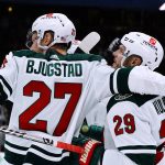 Minnesota Wild defenseman Dmitry Kulikov (29) celebrates his goal against the Arizona Coyotes with center Nick Bjugstad (27) during the second period of an NHL hockey game Wednesday, Nov. 10, 2021, in Glendale, Ariz. (AP Photo/Ross D. Franklin)