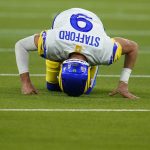 Los Angeles Rams quarterback Matthew Stafford reacts after injuring his ankle while throwing an incomplete pass during the second half of an NFL football game against the Tennessee Titans, Sunday, Nov. 7, 2021, in Inglewood, Calif. (AP Photo/Ashley Landis)