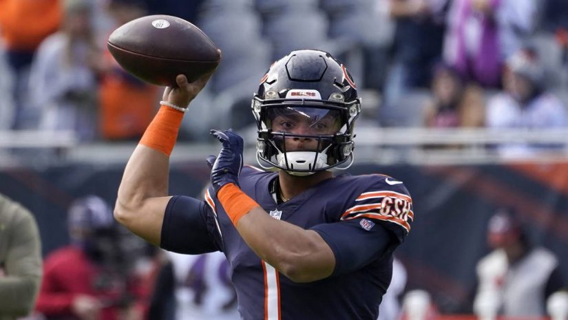 Chicago Bears quarterback Justin Fields warms up before an NFL football game against the Baltimore ...