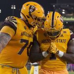 Arizona State running back DeaMonte Trayanum (1) celebrates his touchdown against Southern California with offensive lineman Henry Hattis (70) during the first half of an NCAA college football game Saturday, Nov. 6, 2021, in Tempe, Ariz. (AP Photo/Darryl Webb)