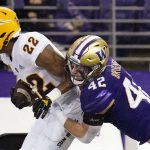 Arizona State's Bryan Thompson (22) is brought down by Washington's Carson Bruener (42) during the first half of an NCAA college football game Saturday, Nov. 13, 2021, in Seattle. (AP Photo/Elaine Thompson)