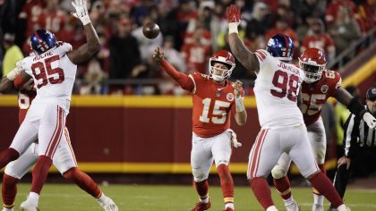 Kansas City Chiefs quarterback Patrick Mahomes throws between New York Giants linebacker Quincy Roc...