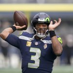 Seattle Seahawks quarterback Russell Wilson warms up before an NFL football game against the Arizona Cardinals, Sunday, Nov. 21, 2021, in Seattle. (AP Photo/Ted S. Warren)