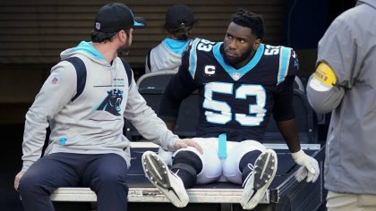 FILE - Carolina Panthers defensive end Brian Burns is taken off the field after getting hunt during...