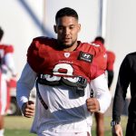 Arizona Cardinals RB James Conner warms up ahead of practice Friday, Dec. 10, 2021, in Tempe. (Tyler Drake/Arizona Sports)