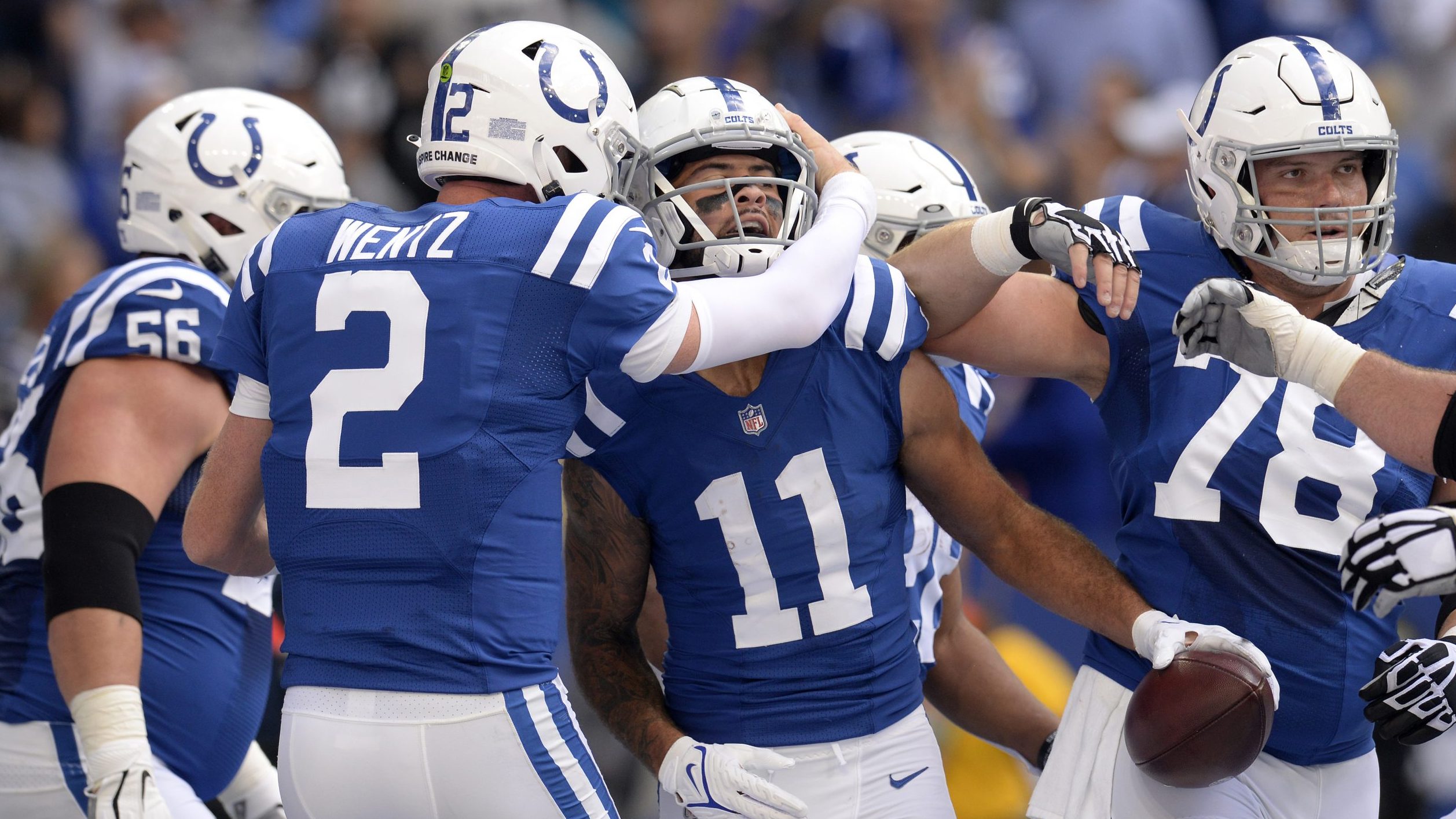 Indianapolis Colts Quarterback Carson Wentz (2) embraces Indianapolis Colts Wide Receiver Michael P...