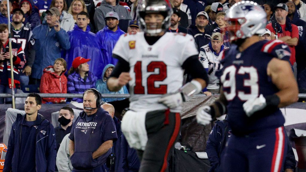 Head coach Bill Belichick of the New England Patriots looks on as Tom Brady #12 of the Tampa Bay Bu...