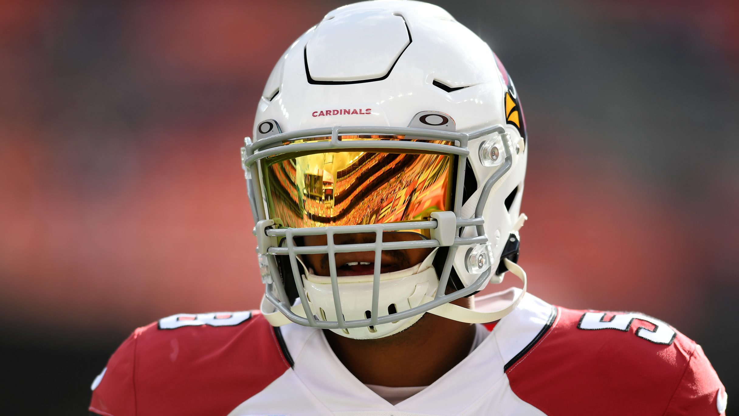Jordan Hicks #58 of the Arizona Cardinals looks on during warm ups prior to the game against the Cl...
