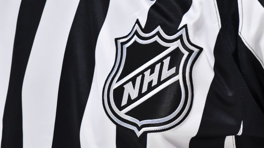 The NHL crest is seen on a referees uniform during the first period between the Montreal Canadiens ...