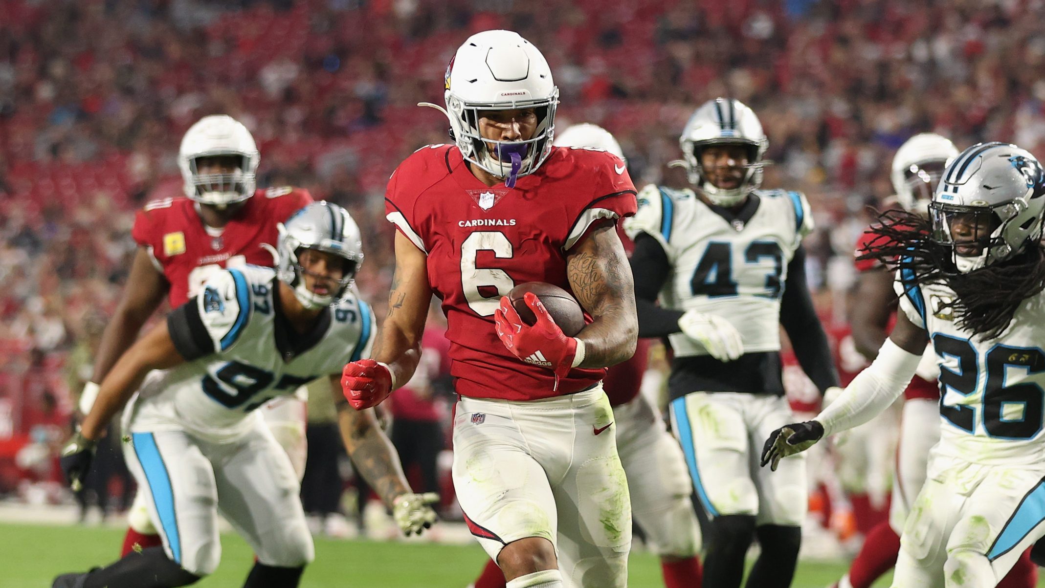 Running back James Conner #6 of the Arizona Cardinals scores on a 11-yard rushing touchdown past co...