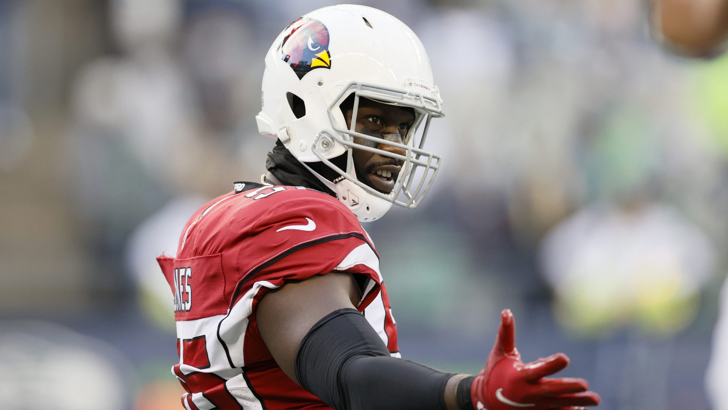 Chandler Jones #55 of the Arizona Cardinals reacts after his tackle against the Seattle Seahawks du...