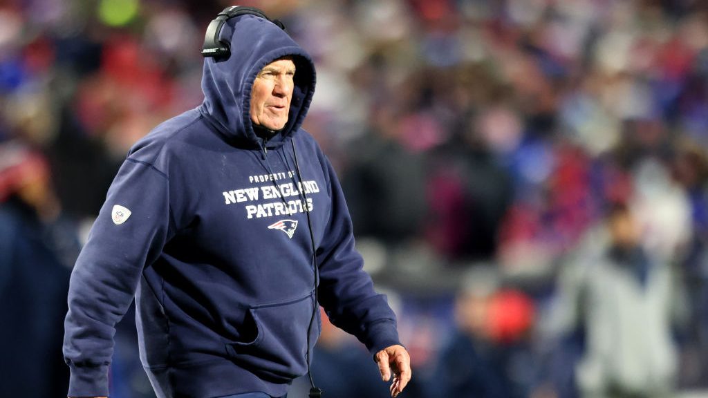 Head Coach Bill Belichick of the New England Patriots walks on the field during an injury timeout d...