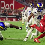 GLENDALE, ARIZONA - DECEMBER 13: A.J. Green #18 of the Arizona Cardinals carries the ball after a reception as Darious Williams #11 and Jordan Fuller #4 of the Los Angeles Rams defends during the fourth quarter at State Farm Stadium on December 13, 2021 in Glendale, Arizona. (Photo by Christian Petersen/Getty Images)