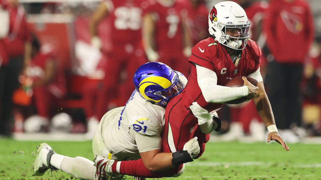 Greg Gaines #91 of the Los Angeles Rams tackles Kyler Murray #1 of the Arizona Cardinals during the...