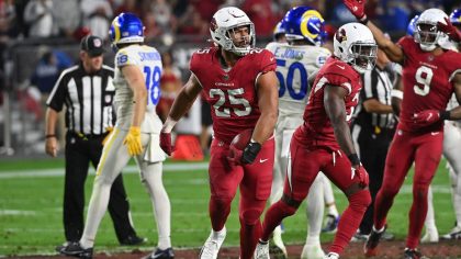 Zaven Collins #25 of the Arizona Cardinals reacts after recovering an onside kick during the fourth...