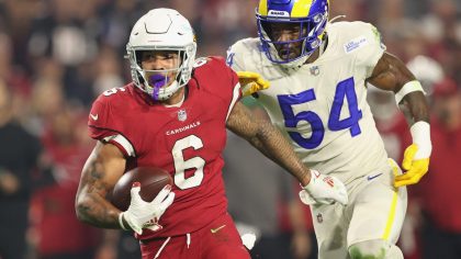 Running back James Conner #6 of the Arizona Cardinals rushes the football past outside linebacker L...