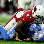 Jordan Phillips #97 of the Arizona Cardinals sacks Jared Goff #16 of the Detroit Lions on the first play of the game in the first quarter at Ford Field on December 19, 2021 in Detroit, Michigan. (Photo by Mike Mulholland/Getty Images)