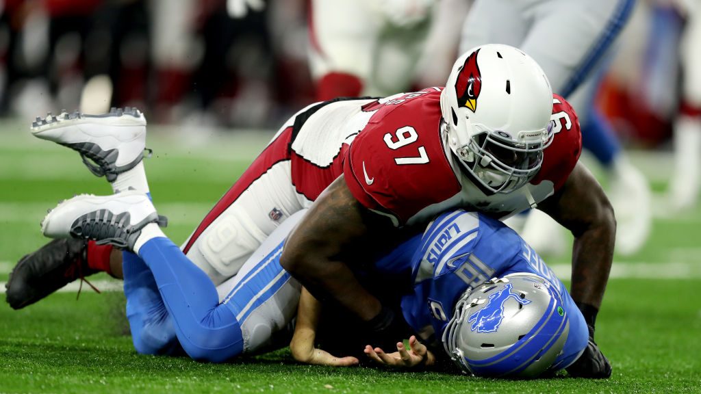Jordan Phillips #97 of the Arizona Cardinals sacks Jared Goff #16 of the Detroit Lions on the first...