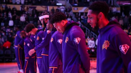 The Phoenix Suns stand during the national anthem ahead of the game against the Los Angeles Lakers ...