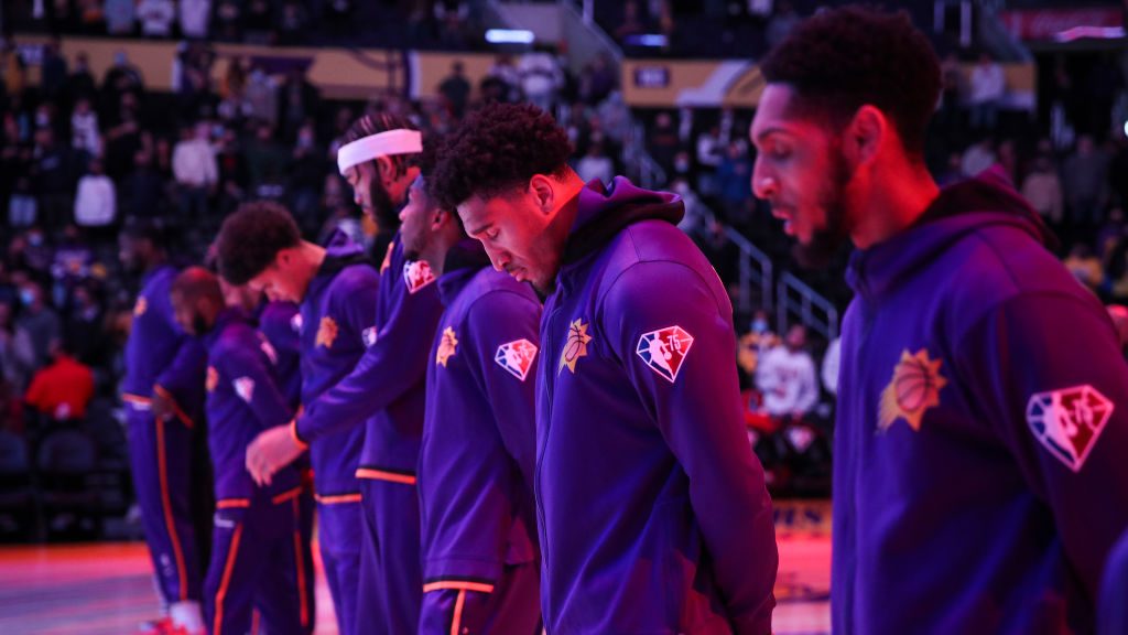 The Phoenix Suns stand during the national anthem ahead of the game against the Los Angeles Lakers ...