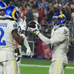 Los Angeles Rams wide receiver Odell Beckham Jr. (3) celebrates his touchdown against the Arizona Cardinals with wide receiver Van Jefferson (12) and other teammates during the first half of an NFL football game Monday, Dec. 13, 2021, in Glendale, Ariz. (AP Photo/Rick Scuteri)