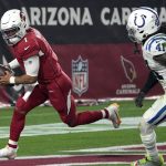 Arizona Cardinals quarterback Kyler Murray picks up a loose ball in the end zone against the Indianapolis Colts during the first half of an NFL football game, Saturday, Dec. 25, 2021, in Glendale, Ariz. Murray was called for intentional grounding on the play resulting in a safety for the Colts. (AP Photo/Rick Scuteri)