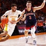 Tennessee guard Santiago Vescovi (25) drives against Arizona guard Pelle Larsson (3) during an NCAA college basketball game Wednesday, Dec. 22, 2021, in Knoxville, Tenn. (AP Photo/Wade Payne)
