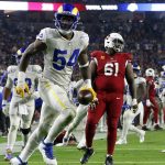 Los Angeles Rams outside linebacker Leonard Floyd (54) celebrates his interception against the Arizona Cardinals as Cardinals center Rodney Hudson (61) looks away during the second half of an NFL football game Monday, Dec. 13, 2021, in Glendale, Ariz. (AP Photo/Ralph Freso)