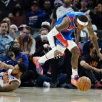Washington Wizards guard Kentavious Caldwell-Pope, right, steals the ball from Phoenix Suns guard Cameron Payne, left, during the first half of an NBA basketball game Thursday, Dec. 16, 2021, in Phoenix. (AP Photo/Ross D. Franklin)