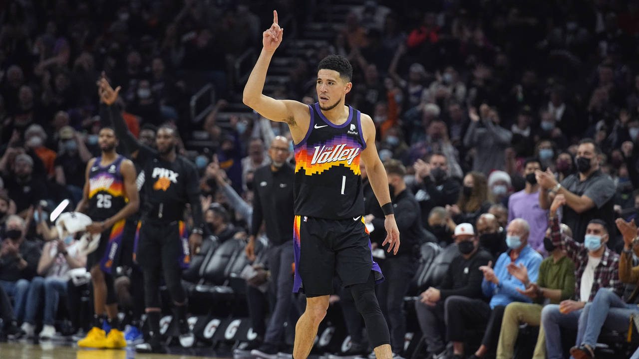 Phoenix Suns guard Devin Booker (1) reacts after scoring against the Oklahoma City Thunder during t...