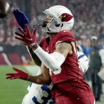 Arizona Cardinals wide receiver Antoine Wesley pulls in a touchdown pass as Indianapolis Colts cornerback Isaiah Rodgers, rear, defends during the second half of an NFL football game, Saturday, Dec. 25, 2021, in Glendale, Ariz. (AP Photo/Rick Scuteri)