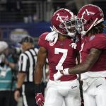 Alabama wide receiver Ja'Corey Brooks (7) celebrates with Jameson Williams (1) after scoring a touchdown against Cincinnati during the first half of the Cotton Bowl NCAA College Football Playoff semifinal game, Friday, Dec. 31, 2021, in Arlington, Texas. (AP Photo/Jeffrey McWhorter)