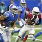 Detroit Lions running back Craig Reynolds rushes during the first half of an NFL football game against the Arizona Cardinals, Sunday, Dec. 19, 2021, in Detroit. (AP Photo/Jose Juarez)