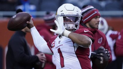 Arizona Cardinals quarterback Kyler Murray warms up before an NFL football game against the Chicago...