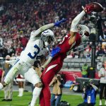 Arizona Cardinals wide receiver Antoine Wesley can't hold on to the ball as Indianapolis Colts cornerback Isaiah Rodgers (34) defends during the second half of an NFL football game, Saturday, Dec. 25, 2021, in Glendale, Ariz. The Colts won 22-16. (AP Photo/Ross D. Franklin)