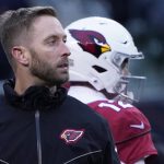 Arizona Cardinals head coach Kliff Kingsbury looks downfield as his team warms up before an NFL football game against the Chicago Bears Sunday, Dec. 5, 2021, in Chicago. (AP Photo/David Banks)