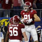 Alabama tight end Cameron Latu (81) celebrates after making a touchdown catch against Cincinnati during the second half of the Cotton Bowl NCAA College Football Playoff semifinal game, Friday, Dec. 31, 2021, in Arlington, Texas. (AP Photo/Michael Ainsworth)