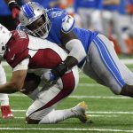 Arizona Cardinals quarterback Kyler Murray (1) is sacked by Detroit Lions outside linebacker Charles Harris (53) during the second half of an NFL football game, Sunday, Dec. 19, 2021, in Detroit. (AP Photo/Jose Juarez)