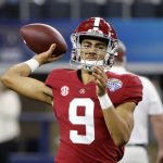 Alabama quarterback Bryce Young (9) warms up before the Cotton Bowl NCAA College Football Playoff semifinal game against Cincinnati, Friday, Dec. 31, 2021, in Arlington, Texas. (AP Photo/Michael Ainsworth)