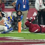 Los Angeles Rams wide receiver Cooper Kupp, left, makes a touchdown catch against Arizona Cardinals cornerback Marco Wilson, right, during the second half of an NFL football game Monday, Dec. 13, 2021, in Glendale, Ariz. (AP Photo/Rick Scuteri)