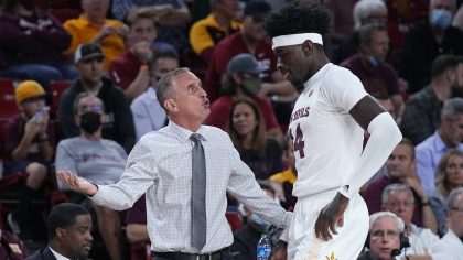 Arizona State coach Bobby Hurley talks to center Enoch Boakye during the first half of the team's N...